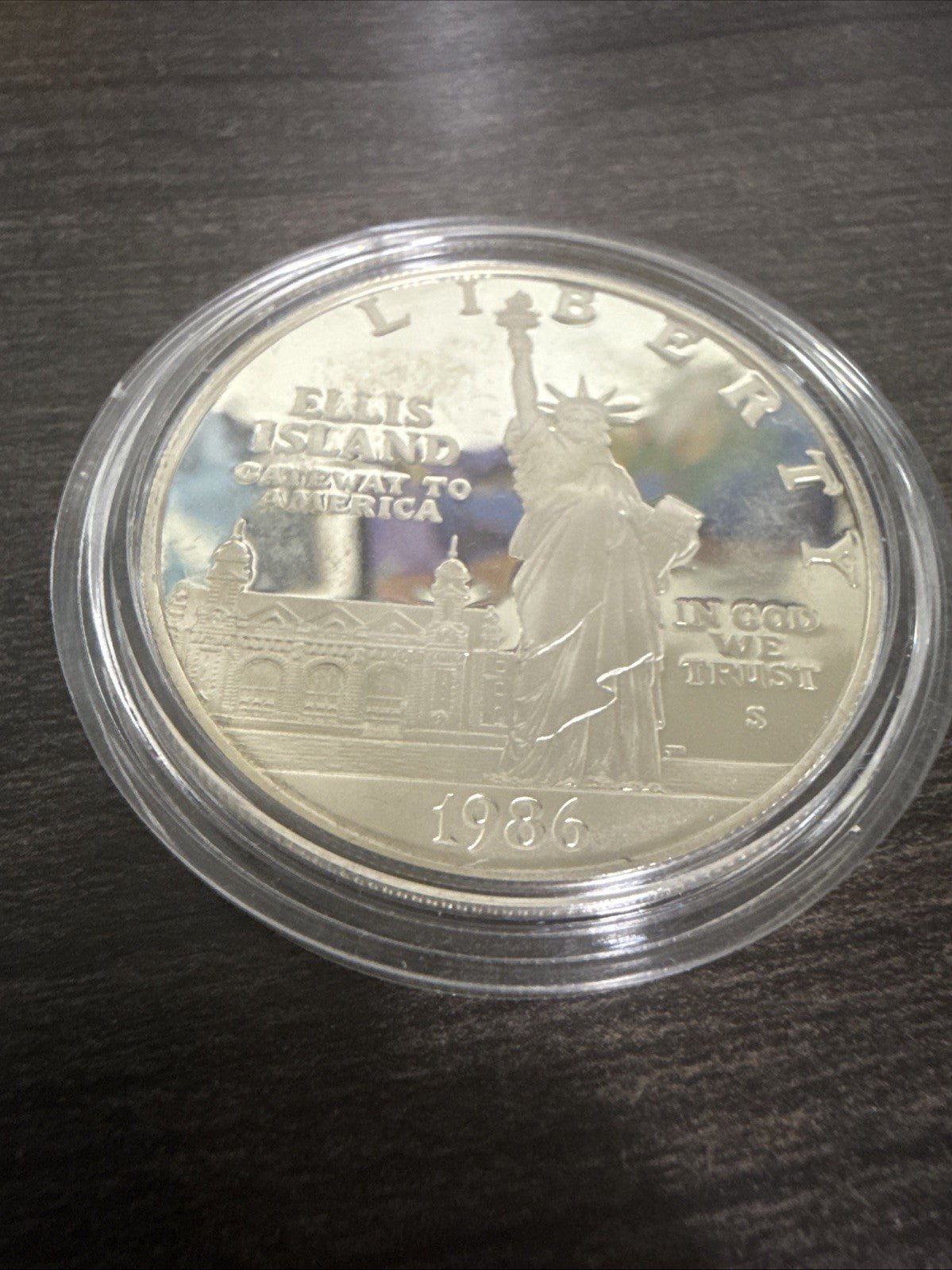 1986 - S Capsuled Ellis Island Gateway to America US Silver Dollar Liberty - toyscardscomics