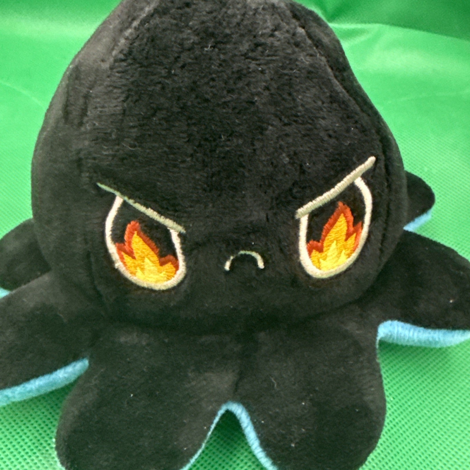 TeeTurtle Reversible Octopus Plush Orange And Black, Grumpy Angry blue sad - toyscardscomics